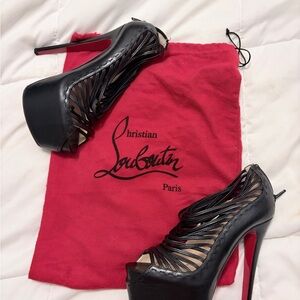 Absolutely gorgeous holiday heels!  Christian Louboutin Black Cut-Out Heels.